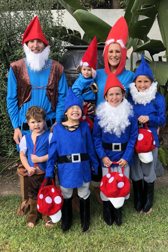 Isaacs with her husband, Rowan, and five of their six children, dressed for Halloween. 