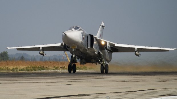 A Russian Su-24 takes off on a combat mission at Hemeimeem airbase in Syria in October.