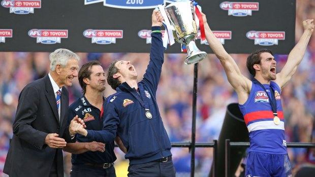 Bob Murphy joins Easton Wood with the 2016 AFL premiership cup.