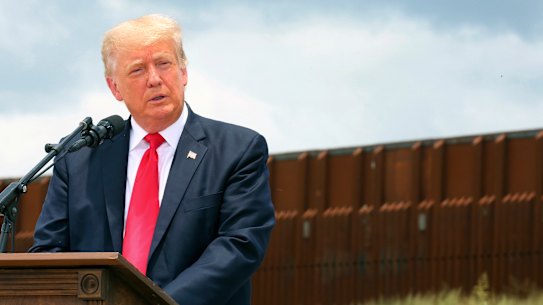 Donald Trump speaks at the border wall between the US and Mexico in June 2021.