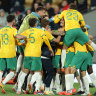 The Socceroos celebrate their third goal.