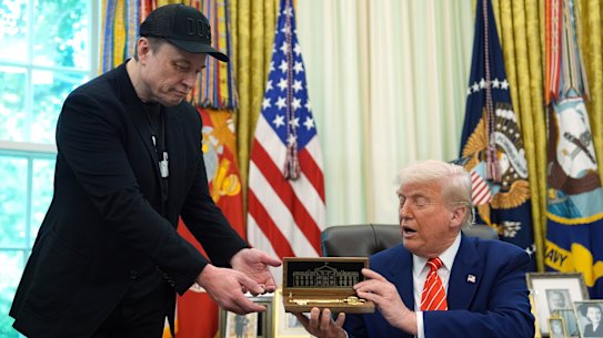 President Donald Trump presents billionaire Tesla chief Elon Musk with a “golden key to the White House” as he leaves the administration.