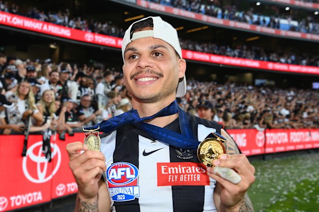 Bobby Hill of the Magpies celebrates winning the Norm Smith Medal in 2023.