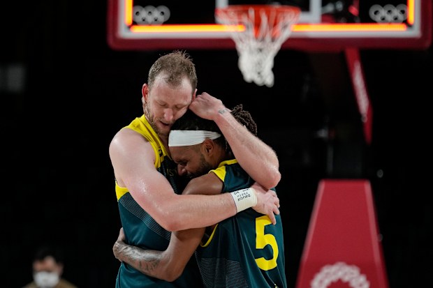 Joe Ingles and Patty Mills after winning the men's basketball bronze medal game