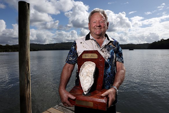 Retired Batemans Bay oyster farmer Bernie Connell with the corpse of Jill, his prized Pacific oyster.