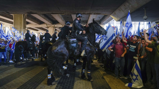 Mounted police disperse demonstrators trying to block the entrance to Israel’s main international airport.
