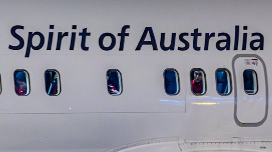 The team visible through their plane windows after landing in Sydney.