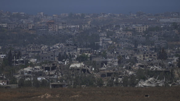 Destroyed buildings in the Gaza Strip, as seen from southern Israel, Friday, May 24, 2024. (AP Photo/Tsafrir Abayov)