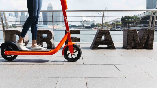 Neuron Mobility's bright orange scooters will soon be seen on Brisbane streets.