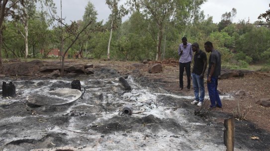 Attacks by extremists are not uncommon in Mali. In this picture from June 2017 locals survey the burned Campement Kangaba following an Islamic extremist attack near Bamako. 