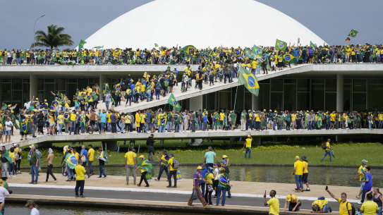 Protesters, supporters of Brazil’s former president Jair Bolsonaro, storm the National Congress building in Brasilia on January 8, a week after his successor Luis Inacio Lula da Silva, took office.