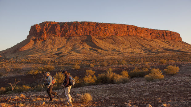 Visitors near Mount Conner on Curtin Springs Station.