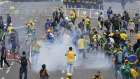 Supporters of former president Jair Bolsonaro clash with police during a protest outside the presidential palace.