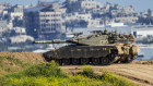 An Israeli soldier on top a tank on the border with the Gaza Strip, in southern Israel.