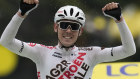Australia’s Ben O’Connor celebrates as he crosses the finish line to win the ninth stage.