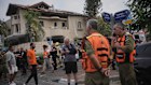 Israeli security forces inspect a house hit by a missile fired from Iran, in Rishon Lezion, Israel, on Saturday, June 14, 2025.