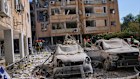 Israeli security forces inspect a destroyed building that were hit by a missile fired from Iran, in Holon, near Tel Aviv, Israel, Thursday, June 19, 2025.