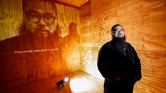Badiucao at his new exhibition, Disagree Where We Must