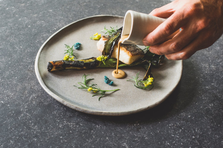 Pan-fried Murray cod, charred leek and shellfish cream at Muse Restaurant.