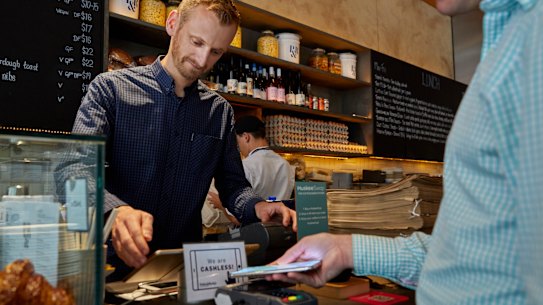 Cafe manager Chris Tate has reaped the benefits of turning his business 
into a cashless operation.