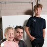Peter Horsley with his children Miranda, 8, and Lucas, 13. The family has invested in solar panels, household batteries and electric cars for financial and environmental reasons.