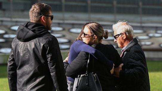 Victor White (right), husband of murder victim Vyleen White, with family and friends arriving at Supreme Court.