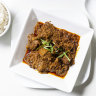 Beef rendang with roasted coconut.