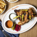 Go-to dish: Half chicken with pickles, condiments and Lebanese bread.