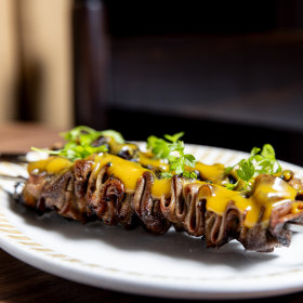 Ox-tongue skewers with mustard dressing.