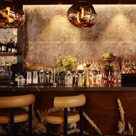 Take a seat at the bar for free chips and olives with your drink.
