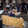 Protesters against the Victorian government’s proposed pandemic laws gather outside State Parliament.
