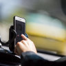 There are perfectly legal reasons to use phones while driving, as long as they are in cradles.