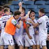 Perth Glory’s Charbel Shamoon celebrates kicking a goal with teammates. 