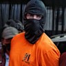 Accused killer Darcy Jenson being paraded at a police press conference in Bali on Thursday.