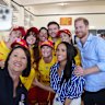 Prince Harry and Meghan pose for a selfie with volunteer first responders at Bondi Surf Bathers’ Life Saving Club.