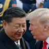 FILE - President Donald Trump, right, talks with China’s President Xi Jinping during a welcome ceremony at the Great Hall of the People in Beijing, Nov. 9, 2017. (AP Photo/Andy Wong, File)