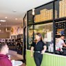 The pizza shop is housed inside a functioning laundromat in a glass-walled space that was about to be demolished.