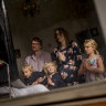 The Mitcham family - Ashley, Lindsay,  Jane 7, Francis 4 and Dominic 3 - watch the Easter Sunday Mass on their television. 