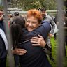 One Nation leader Pauline Hanson hugs a supporter before addressing the crowd at the Put Australia First rally in Melbourne’s Flagstaff Gardens, in November 2025.