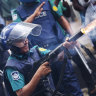 Police fire tear gas shells to disperse students in Dhaka, Bangladesh.