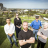 Jin Li, Rebecca Silver, Taras Kontek (centre), Mike Samos and Suzanne Gooda live alongside Junction Oval and are concerned about a plan to erect light towers.