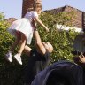 Rizkalla celebrates his auction win with his daughter.