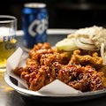 Fried chicken washed down with Cass beer at Seven Star Pocha in Koreatown. 