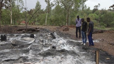 Attacks by extremists are not uncommon in Mali. In this picture from June 2017, locals survey the burned Campement Kangaba after an Islamic extremist attack near Bamako. 