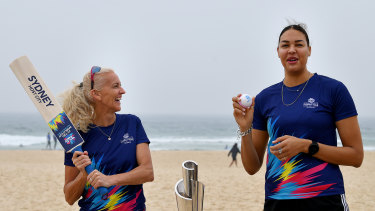 Kerri Pottharst and Liz Cambage try their hand at a bit of cricket. 
