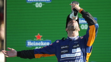 Daniel Ricciardo celebrates his victory in trademark style at Monza in Italy.