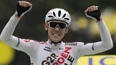 Australia’s Ben O’Connor celebrates as he crosses the finish line to win the ninth stage.