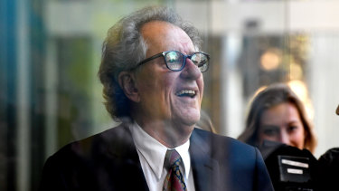 Geoffrey Rush leaves court on Monday afternoon.