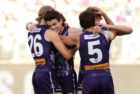 The Dockers celebrate a goal.