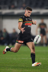 Nathan Cleary lines up a high kick.